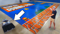 Thumbnail for World Record Domino Robot (100k dominoes in 24hrs) | Mark Rober