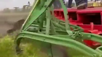 Thumbnail for A restored 1905 Case 150 steam tractor, the largest ever built by Case, pulling 44 John Deere plows.  