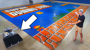 Thumbnail for World Record Domino Robot (100k dominoes in 24hrs) | Mark Rober
